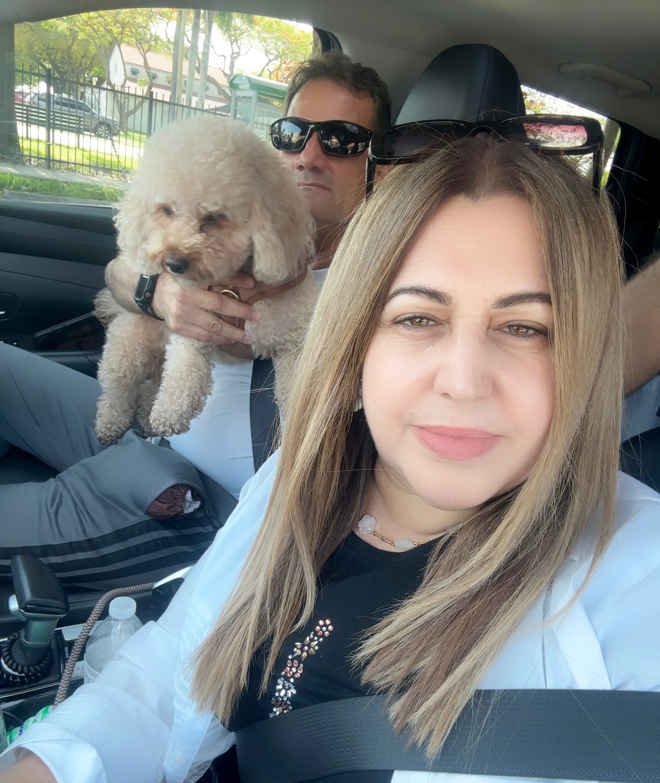 Ariella with family and Muppy in the car